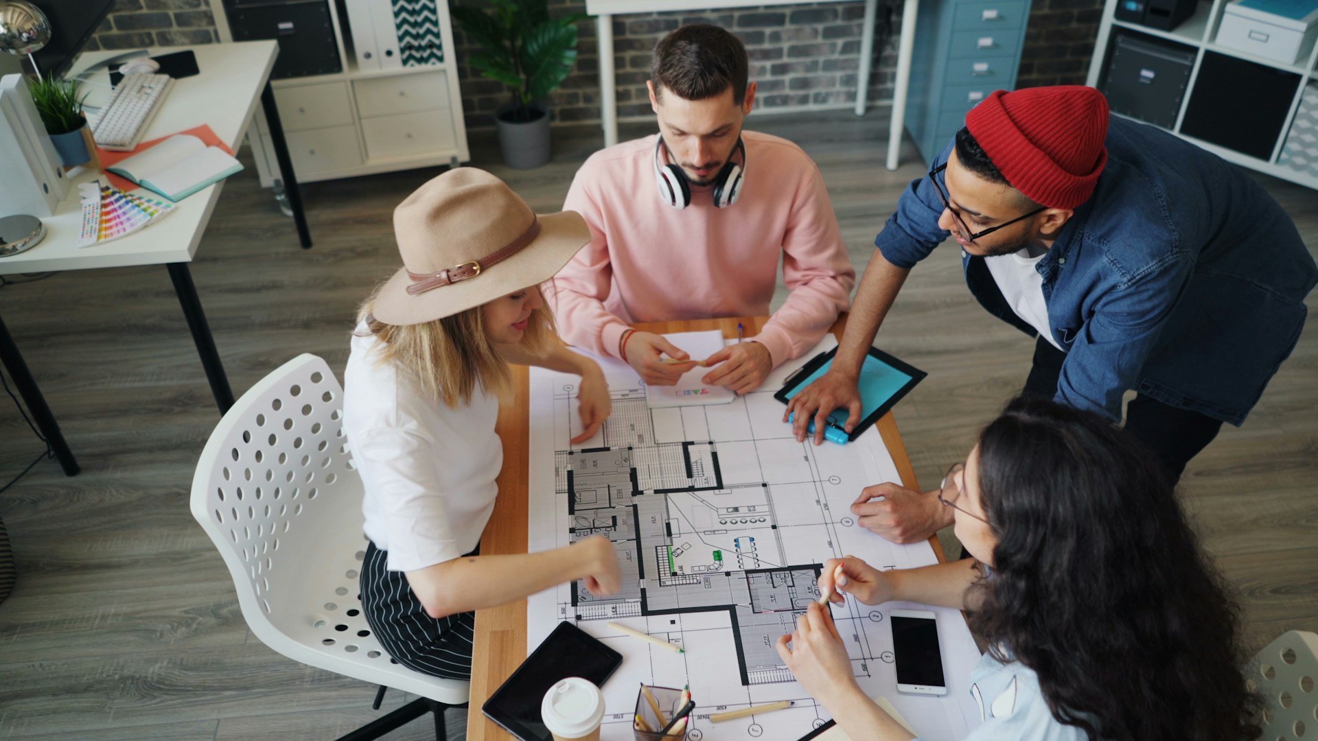 a group of people sitting around a table
